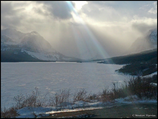 - Sun Beams Over Frozen Lake Sherburne, Glacier NP -