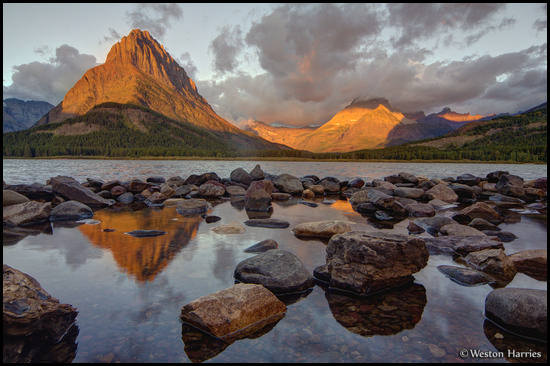 - First Light on Grinnell Pt. and Mt. Wilbur, Reflected in Swiftcurrent Lake, Glacier NP -