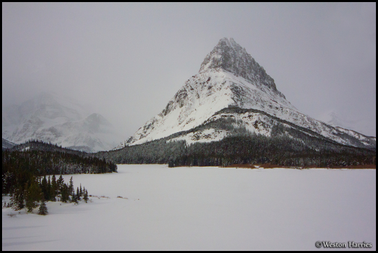 - Frozen Swiftcurrent Lake and Grinnell Point Under Moonlight, Glacier NP -