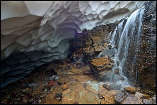 - Waterfall in the Middle of a Snow Cave, Glacier NP -