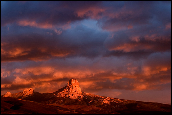 - Chief Mountain Glowing During a Stormy Sunrise, Glacier NP -