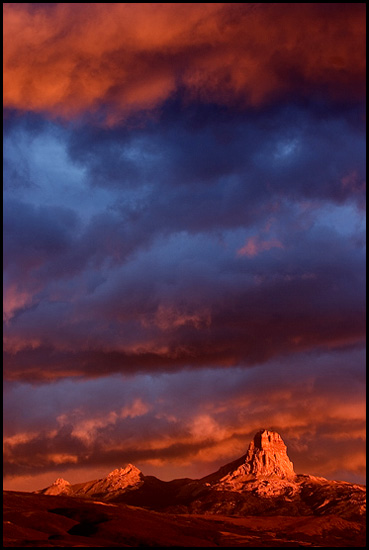 - Chief Mountain Glowing During a Stormy Sunrise, Glacier NP -