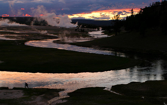 - Fly Fisherman Hiking Along the Firehole River, Sunset, Yellowstone NP -
